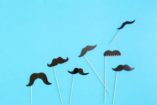 istock Paper mustache on blue background, top view. Father's Day concept 854894002