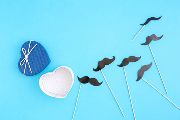 istock Open gift box with paper mustache, top view. Father's Day concept 854894004