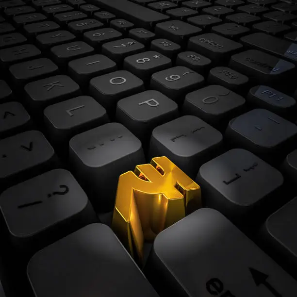 3D illustration of computer keyboard with gold rupee key
