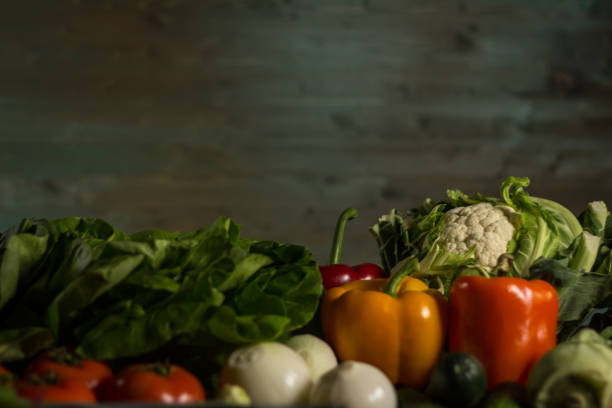 istock Assortment of fresh homegrown vegetables. Rustic background 854900414