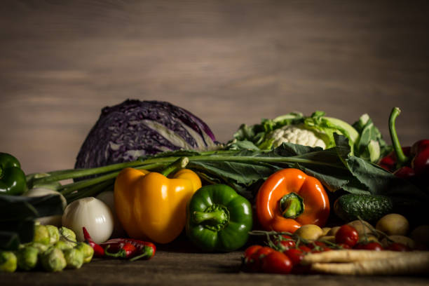 istock Assortment of fresh homegrown vegetables. Rustic background 854900490