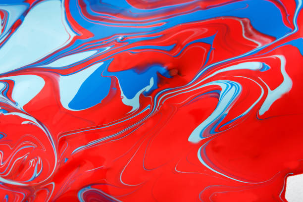 Liquid marbling paint background. Fluid painting bright abstract texture. Colorful mix of acrylic vibrant colors.