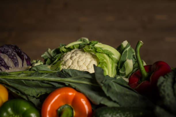 istock Assortment of fresh homegrown vegetables. Rustic background 854900714