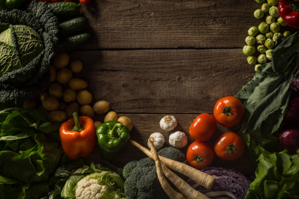 istock Assortment of fresh homegrown vegetables. Rustic background 854902930