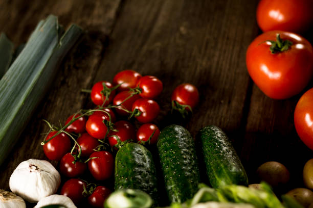 istock Assortment of fresh homegrown vegetables. Rustic background 854903180