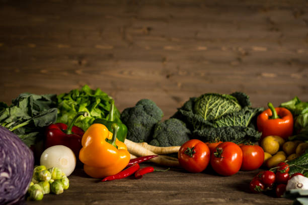 istock Assortment of fresh homegrown vegetables. Rustic background 854903246