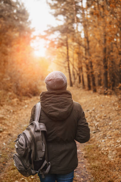 istock Woman walking in the autumn Park. 854903736