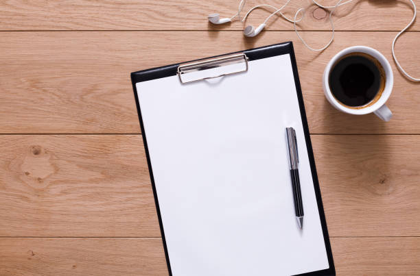 istock Mockup for checklist, note paper and coffee on wood background 854903846