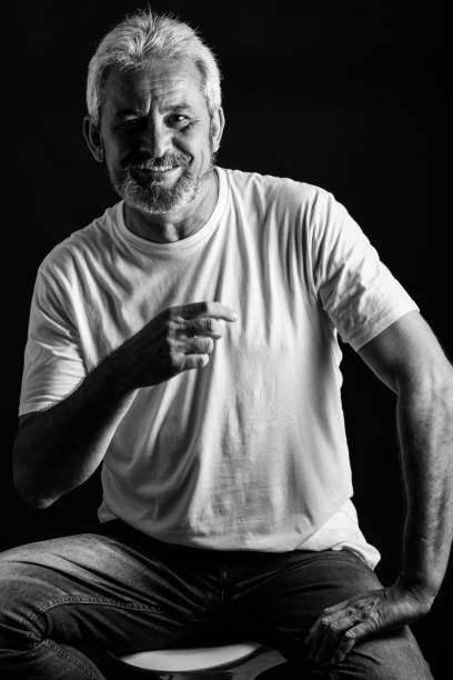 istock Mature man with white hair and beard smiling 854912242