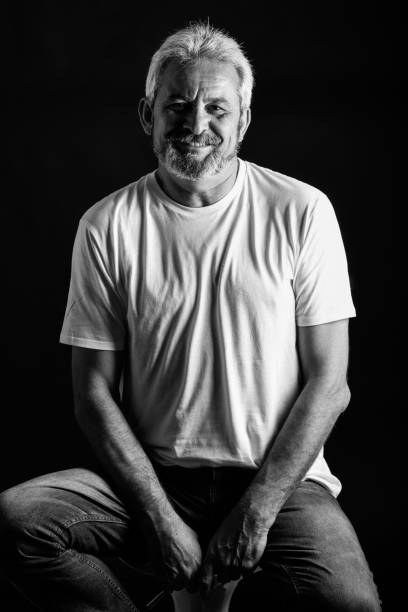 istock Mature man with white hair and beard smiling 854912344