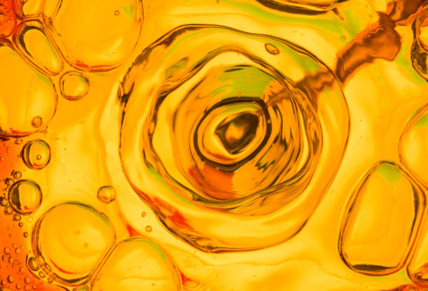 istock oil unevenly in water 854912716