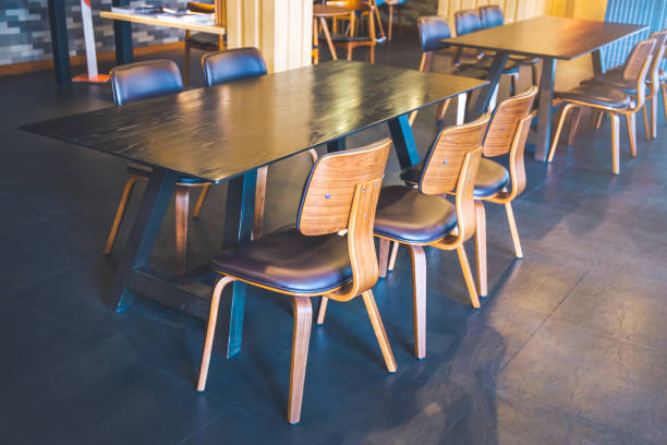 istock Table and wooden chairs in a modern coffee shop. 854923392