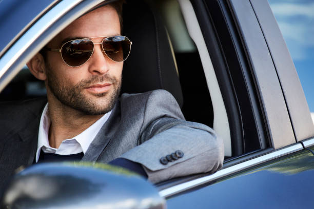 istock Shades dude in car 854924798