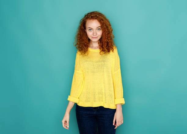 istock Cheerful girl in casual clothes posing at studio 854924858