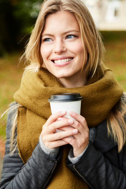 istock Park girl with coffee 854930004