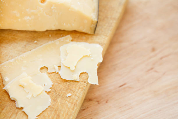 istock Cheese platter, parmesan on natural wooden board 854930414