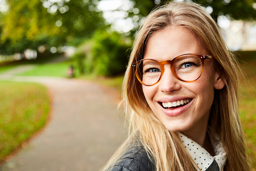 Portrait of beautiful smiling girl in glasses