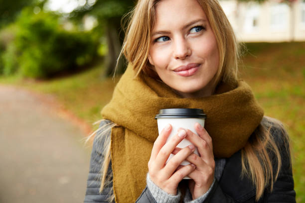 istock Coffee girl in park 854931514
