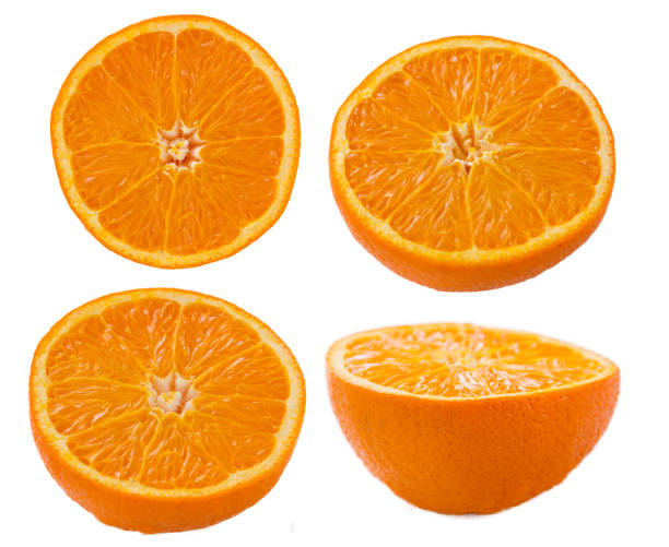 orange scheiben auf weißem hintergrund - vibrant color part of full studio shot stock-fotos und bilder