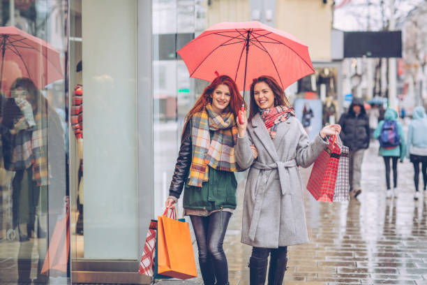 Christmas shopping, best time of the year Friens enjoy in shopping, they walking through city and preparing gifts for Christmas city street consumerism window display vienna stock pictures, royalty-free photos & images