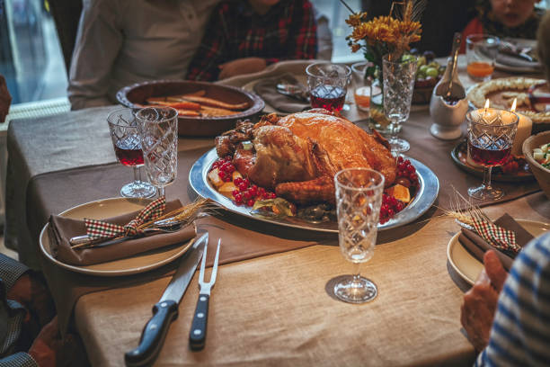 istock Family Having Traditional Holiday Stuffed Turkey Dinner 854938244