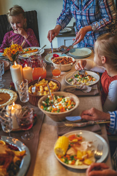 istock Family Having Traditional Holiday Stuffed Turkey Dinner 854938270