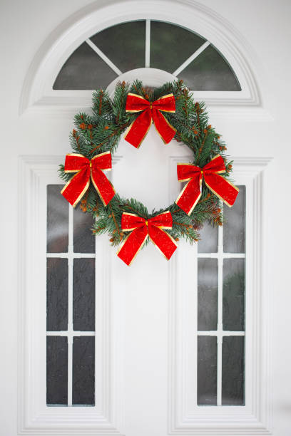 istock Christmas wreath on a  door 854942196