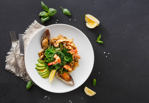 istock Warm salad with grilled seafood flat lay 854943070