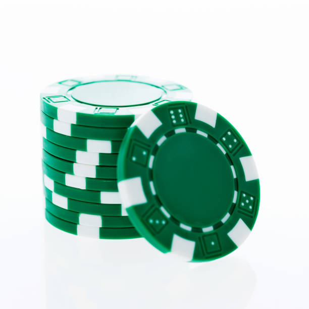 istock A stack of green poker chips on white background 854945750