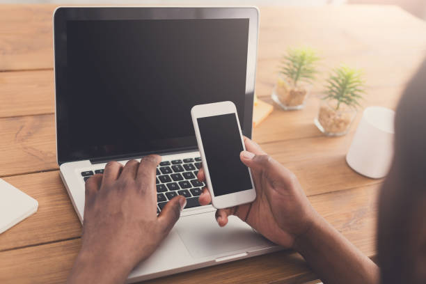 istock African-american businessman in office type on laptop 854949644