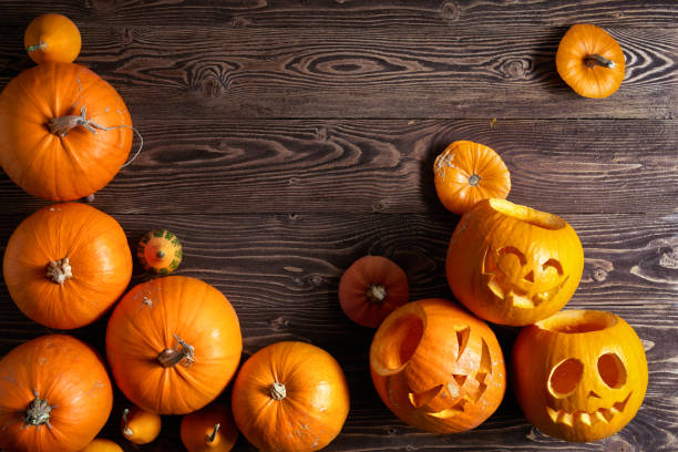 Halloween pumpkin over wooden background