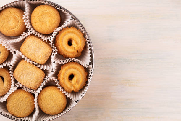 istock Closeup of Danish butter cookies in tin with copyspace 854953920