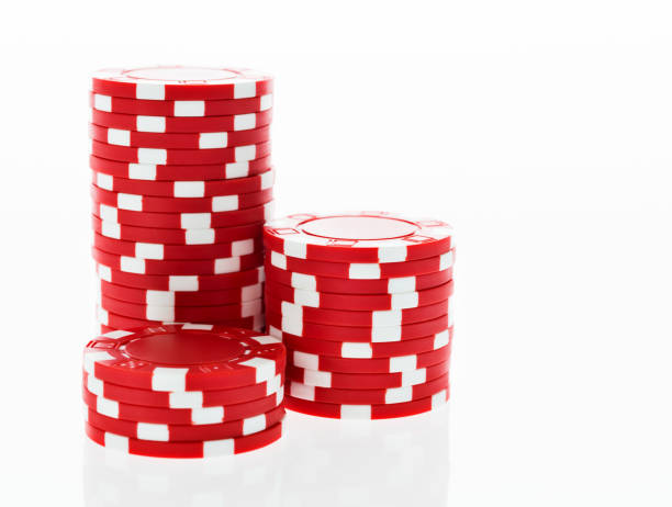 istock Three stacks of red poker chips on white background 854960698
