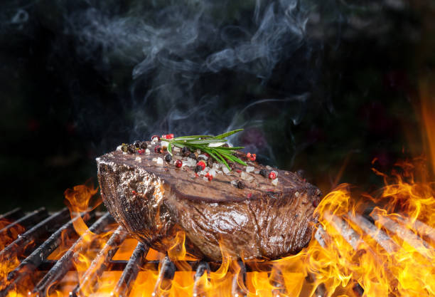 istock Delicious grilled beef steak on a barbecue grill 854961154