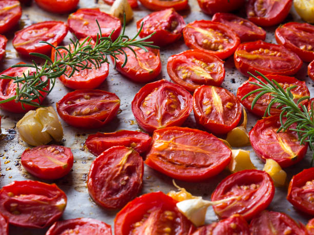 istock Red heirloom tomatoes baked with garlic 854968958