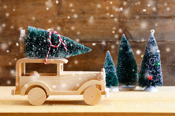 istock Wooden car carrying a christmas tree 854974064