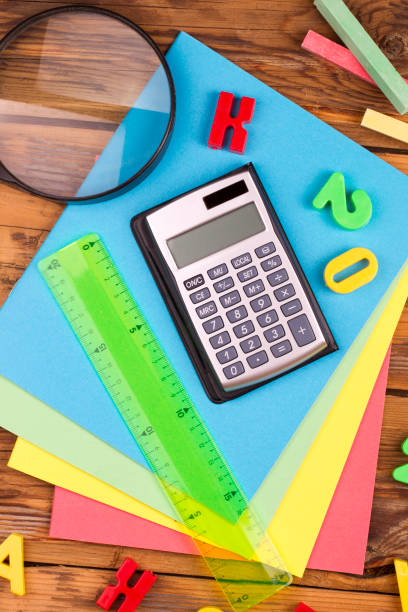 Back to school. Set of school objects and breakfast on wooden desk