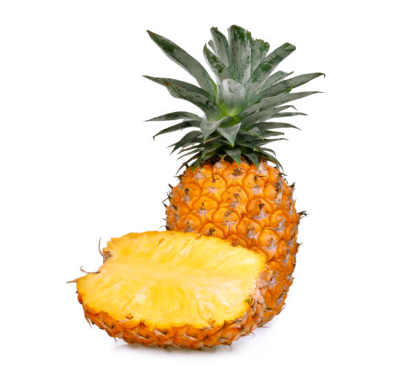 istock ripe whole and half pineapple with slice isolated on white background 854981182