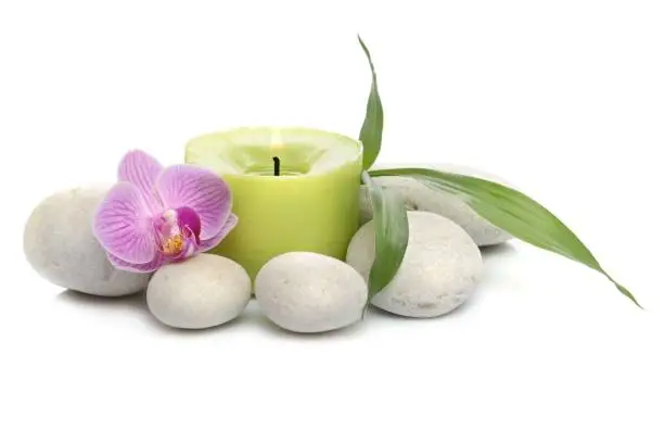 Photo of bamboo, candle, Spa stones on white background