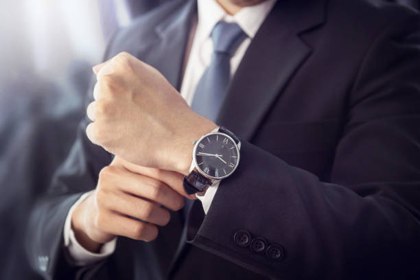 istock Closeup watch on hand businessman. 854984542