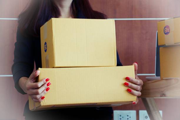 istock Woman in Asia is working on computer. She is selling things on line. Work from home concept 854987922