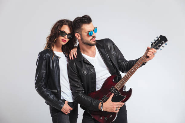 istock man playing electric guitar for his woman 854988888