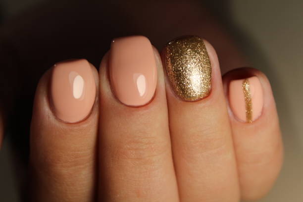 istock Youth manicure design, color coffee with gold 854988920