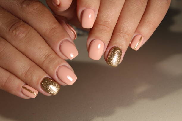 istock Youth manicure design, color coffee with gold 854989332