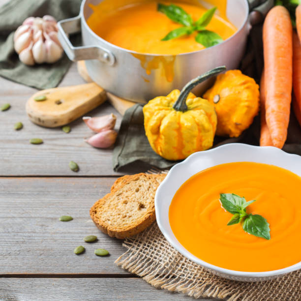 istock Fall autumn roasted orange pumpkin carrot soup with garlic 854989588