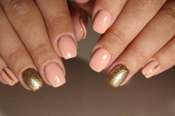 istock Youth manicure design, color coffee with gold 854989622