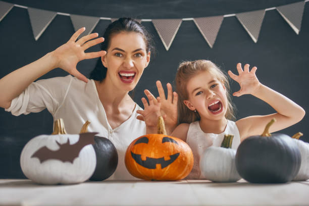 istock family preparing for Halloween. 854998960