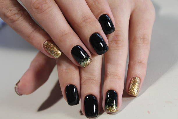 istock manicure design black and gold 854999000