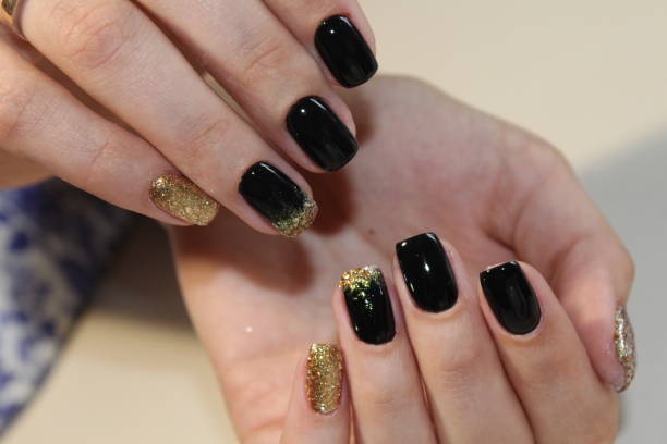 istock manicure design black and gold 854999038