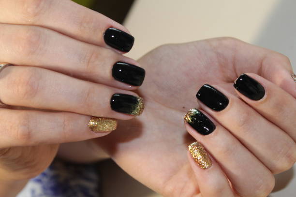 istock manicure design black and gold color 854999108